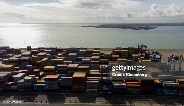 Shipping containers on the dockside at the Port of Felixstowe, owned by a unit of CK Hutchison Holdings Ltd., in Felixstowe, UK, on Monday, March 4,...