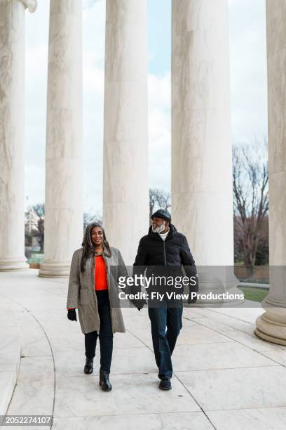 african american senior couple visiting the jefferson memorial in washington dc - jefferson memorial stock pictures, royalty-free photos & images