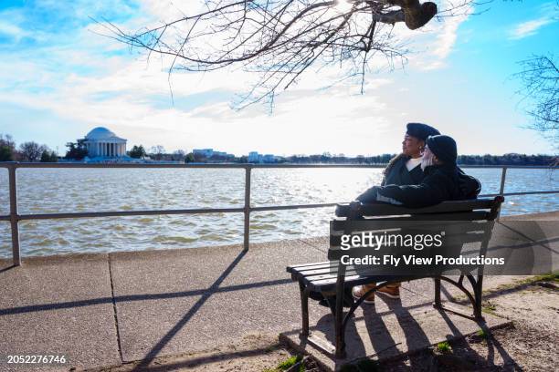 senior couple enjoying scenic view of the jefferson memorial - jefferson memorial stock pictures, royalty-free photos & images