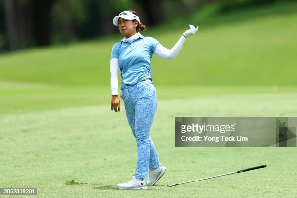 Jenny Shin of South Korea drops her club after playing her second shot from the 18th fairway during Day Three of the HSBC Women's World Championship...