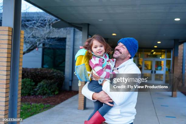 loving dad picking daughter up from school - hi 5 stock pictures, royalty-free photos & images