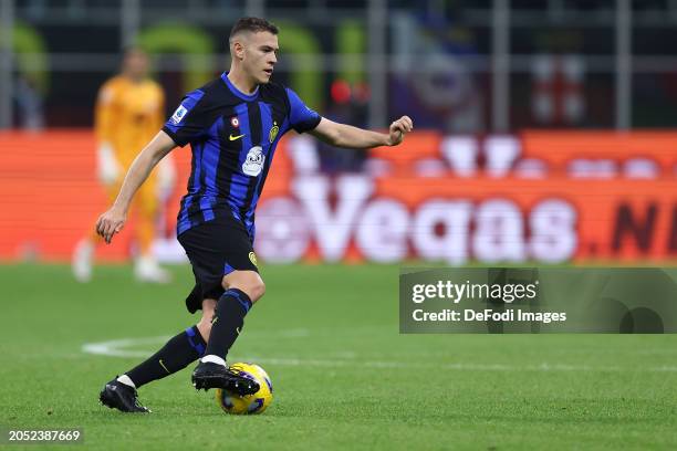 Kristjan Asllani of FC Internazionale controls the ball during the Serie A TIM match between FC Internazionale and Genoa CFC at Stadio Giuseppe...