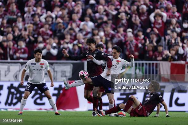 Of Vissel Kobe and Tomoya KOYAMATSU of Kashiwa Reysol battle for the ball during the J.LEAGUE MEIJI YASUDA J1 2nd Sec. Match between Vissel Kobe and...