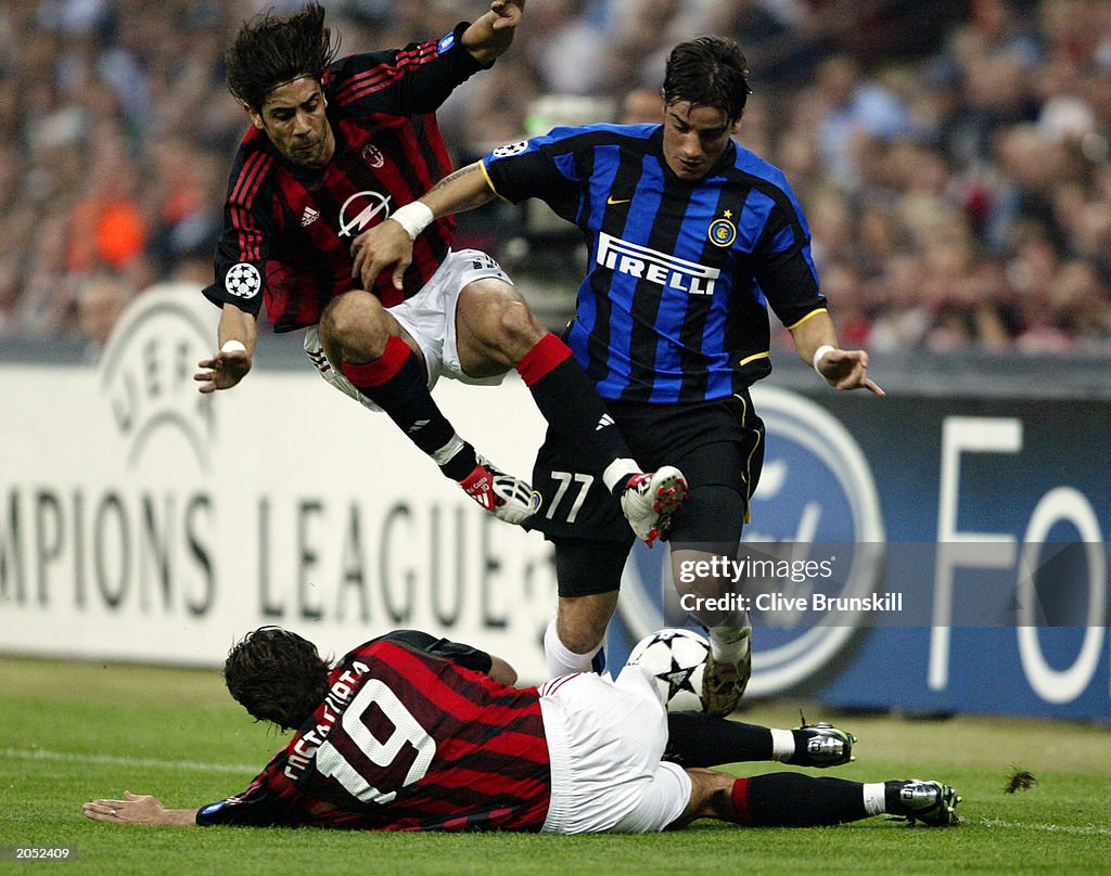 Rui Costa and Alessandro Costacurta of AC Milan and Francesco Coco of Inter Milan