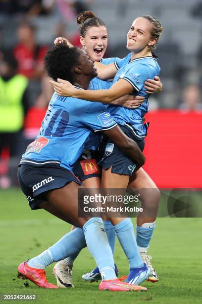 Mackenzie Hawkesby of Sydney FC celebrates with Princess Ibini and Kirsty Fenton of Sydney FC after scoring a goal during the A-League Women round 18...