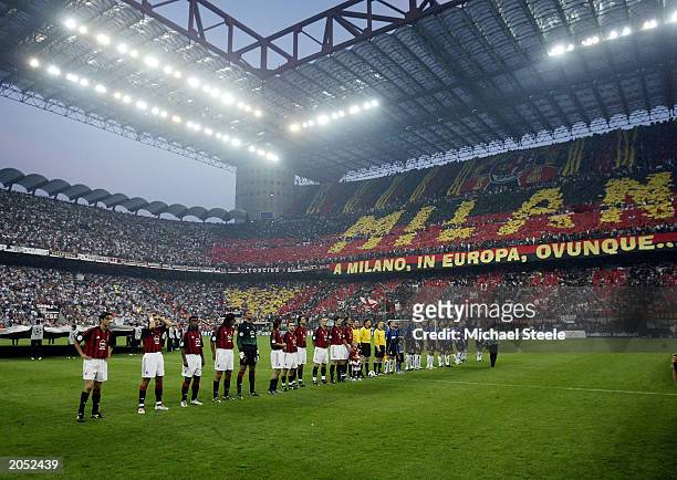 Milan and Inter Milan players line-up in front of an amazing atmosphere before the UEFA Champions League Semi-Final First Leg match between AC Milan...
