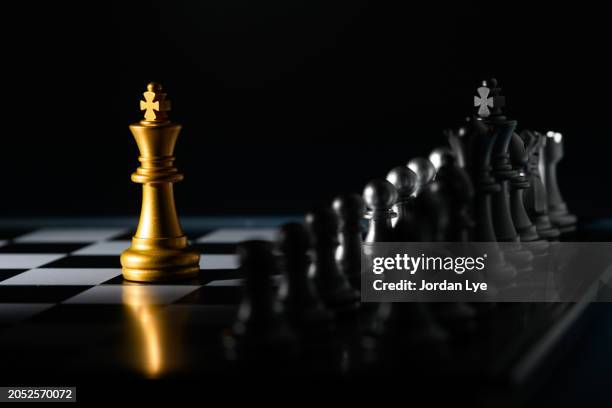 king of chess that stands in front of enemy - rivalry stock pictures, royalty-free photos & images