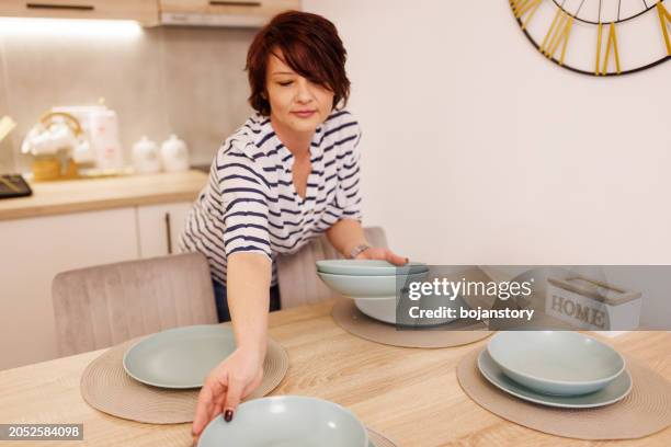 excited about the arrival of guests - woman empty plate stock pictures, royalty-free photos & images