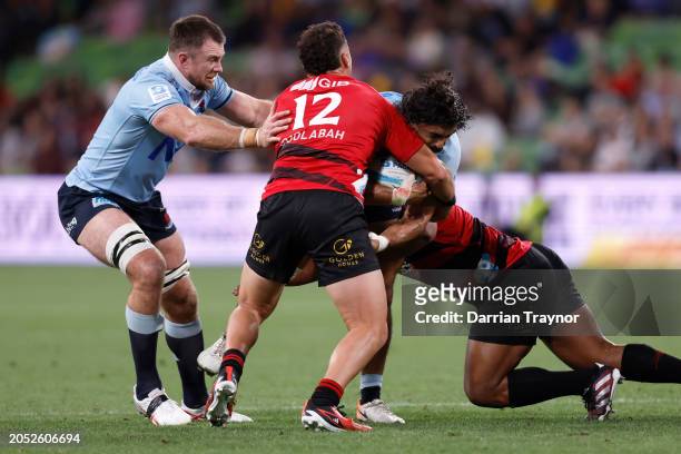 David Havili of the Crusaders tackles Charlie Gamble of the Waratahs during the round two Super Rugby Pacific match between Crusaders and NSW...