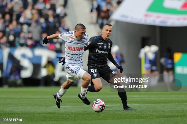 Yota KOMI of Albirex Niigata and JUAN ALANO of Gamba Osaka battle for the ball during the J.LEAGUE MEIJI YASUDA J1 2nd Sec. Match between Gamba Osaka...