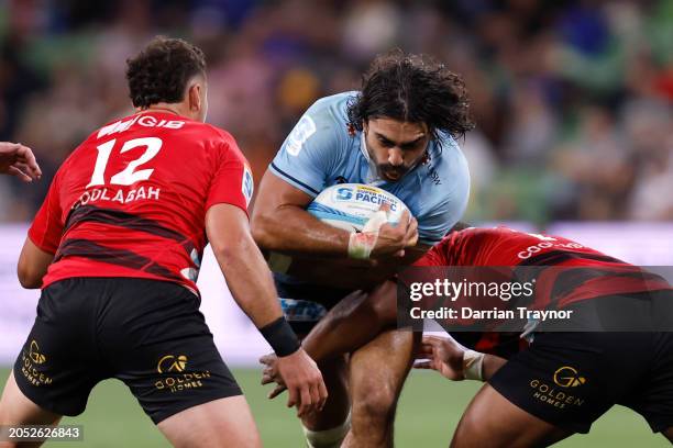 David Havili of the Crusaders tackles Charlie Gamble of the Waratahs during the round two Super Rugby Pacific match between Crusaders and NSW...