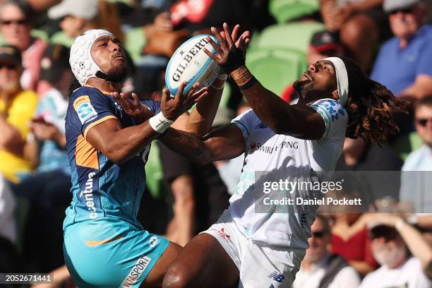 Viliami Fine of Moana Pasifika and Selestino Ravutaumada of Fijian Drua contest the ball during the round two Super Rugby Pacific match between Moana...