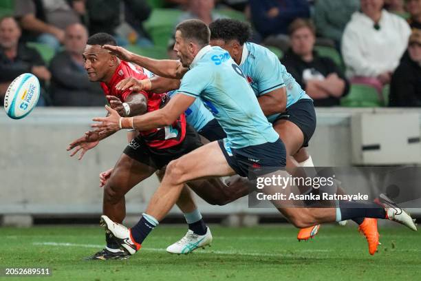 Sevu Reece of the Crusaders and Jake Gordon of the Waratahs contest for the ball near the try line during the round two Super Rugby Pacific match...