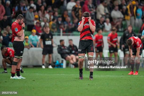 Scott Barrett of the Crusaders and Crusaders players react after defeat at the final whistle during the round two Super Rugby Pacific match between...