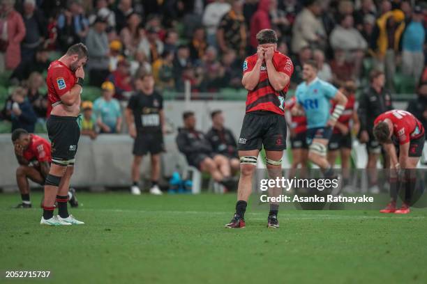 Scott Barrett of the Crusaders and Crusaders players react after defeat at the final whistle during the round two Super Rugby Pacific match between...