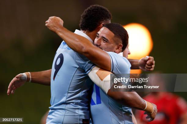 Miles Amatosero and Mosese Tuipulotu of the Waratahs celebrates the win after the round two Super Rugby Pacific match between Crusaders and NSW...