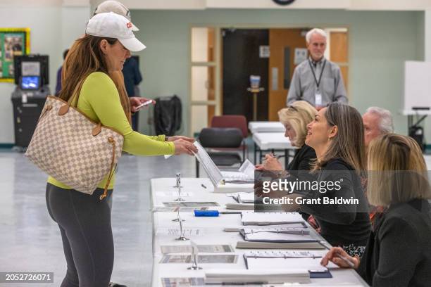 Voters arrive and check in on Super Tuesday at Mt. Moriah Primitive Baptist Church, Precinct 11 Mecklenburg County, on March 5, 2024 in Charlotte,...