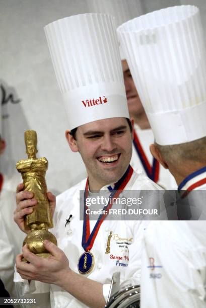 French 26-year-old cook Serge Vieira speaks with Paul Bocuse after winning the golden 'Bocuse' 26 January 2005 at the 10th Bocuse d'Or gastronomy...