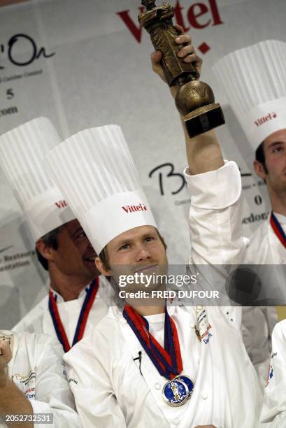 Danish Rasmus Kofoed holds his trophy after winning the bronze 'Bocuse' 26 January 2005 at the 10th Bocuse d'Or gastronomy contest in Lyon. AFP PHOTO...