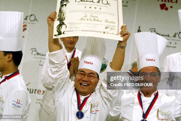 Swiss cook Dominic Bucher, holds the "best promotion" prize, 26 January 2005 at the 10th Bocuse d'Or gastronomy contest in Lyon. AFP PHOTO FRED DUFOUR