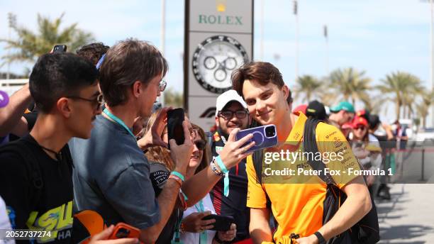 Oscar Piastri of Australia and McLaren greets fans as he arrives at the circuit prior to the F1 Grand Prix of Bahrain at Bahrain International...