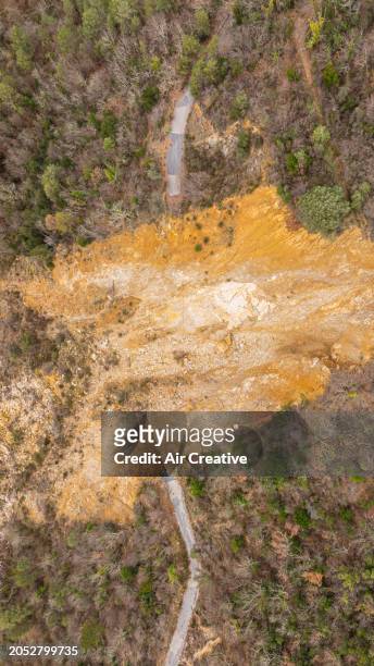 aerial image of an abandoned road destroyed by a large landslide, alpes-maritimes, france - air france stock pictures, royalty-free photos & images