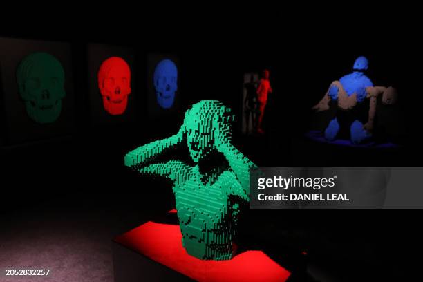 Artworks by US Lego artist Nathan Sawaya are pictured during an exhibition of his work entitled 'Art of the Brick', in Brick Lane, east London on...