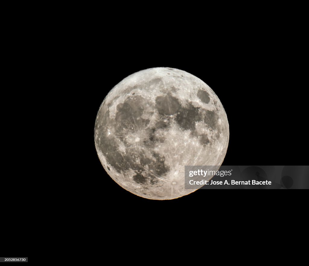 Full moon over a dark sky.