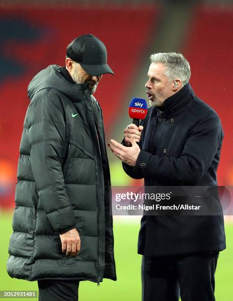 Jurgen Klopp, Manager of Liverpool talks to Jamie Carragher after the Carabao Cup Final match between Chelsea and Liverpool at Wembley Stadium on...