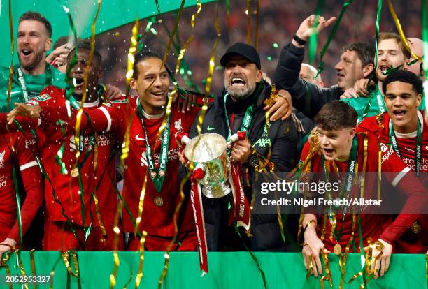 Virgil van Dijk of Liverpool and Jurgen Klopp, Manager of Liverpool celebrate with trophy after winning the Carabao Cup Final after the match between...