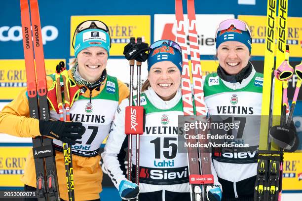 Victoria Carl of Germany in second place, Krista Parmakoski of Finland in first place and Kerttu Niskanen of Finland in third place on the podium...