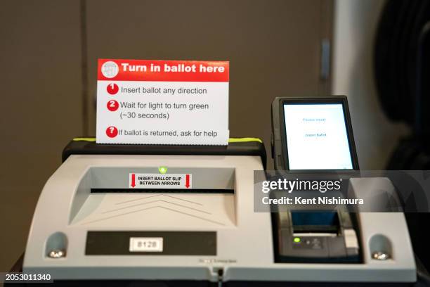 Ballot counting machine, as voters cast their ballots at the Arlington Public Library's Central Library on March, 5 2024 in Arlington, Virginia. 15...