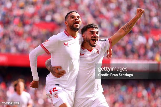 Yousseff En-Nesyri of Sevilla FC celebrates scoring his team's second goal with team mate Isaac Romero during the LaLiga EA Sports match between...