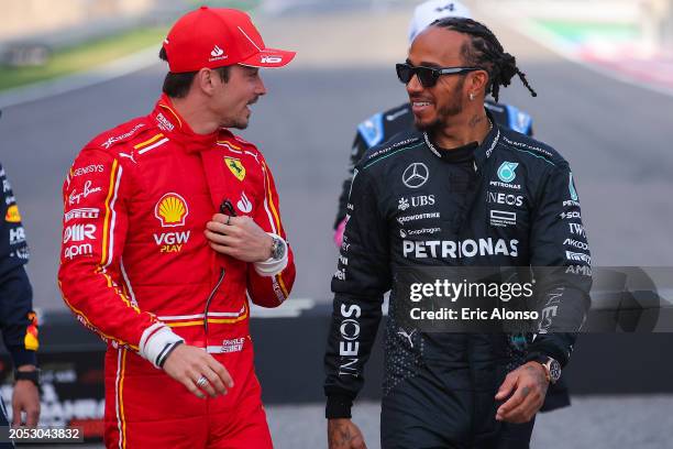 Lewis Hamilton of Great Britain and Mercedes speaks with Charles Leclerc of Monaco and Scuderia Ferrari during the F1 Grand Prix of Bahrain at...