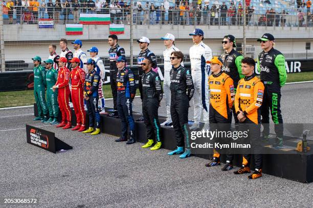 All 2024 F1 drivers line up on the grid for a group photo prior to the F1 Grand Prix of Bahrain at Bahrain International Circuit on March 2, 2024 in...