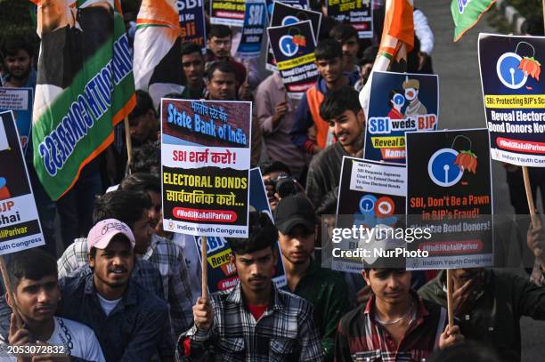 Members of the Indian Youth Congress, the youth wing of India's main opposition party, the Indian National Congress, are holding placards at a...