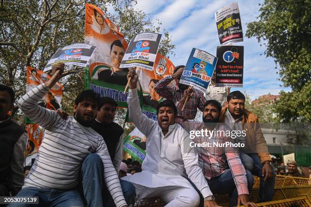 Members of the Indian Youth Congress, the youth wing of India's main opposition, the Indian National Congress, are shouting slogans at a protest...