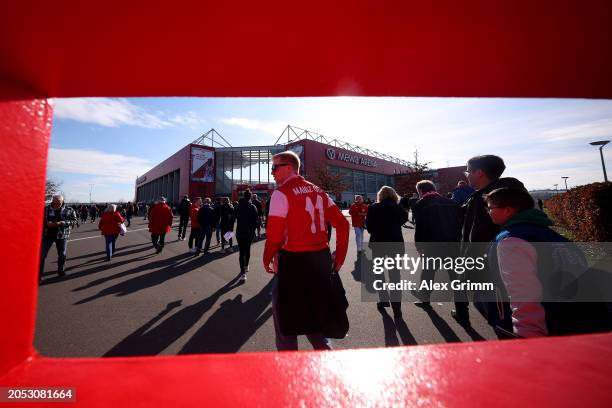 General view, through a gap in the 1.FSV Mainz 05 sign on the outside of the stadium, as fans of 1.FSV Mainz 05 arrive prior to the Bundesliga match...