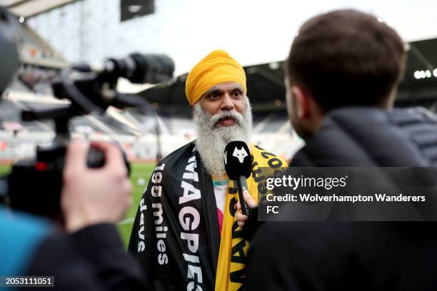 Manny Singh Kang speaks to the media on the inside of the the stadium, after completing his walk from Wolverhampton to Newcastle to raise funds for...