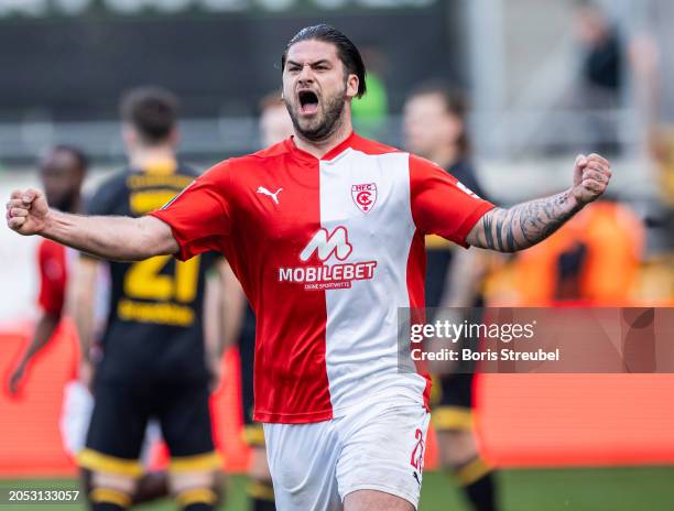 Dominic Baumann of Hallescher FC celebrates after scoring his team's first goal during the 3. Liga match between Hallescher FC and Dynamo Dresden at...