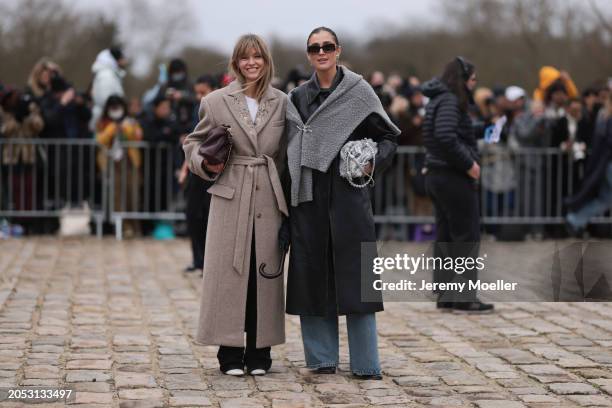 Jeanette Madsen was seen wearing dark pants, white shoes, a dark red bag, white top and beige long coat and Darja Barannik was seen wearing denim...