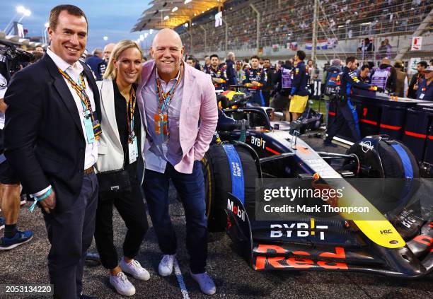 Zara Tindall and Mike Tindall pose for a photo on the grid with the car of Max Verstappen of the Netherlands and Oracle Red Bull Racing prior to the...