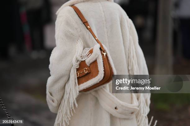 Maria Helena Bordon Meireles is seen wearing beige shorts, a beige pullover with turtle neck as well as a fluffy beige Max Mara coat and a brown...