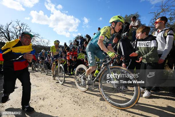 Sergio Higuita of Colombia and Team BORA - hansgrohe competes while fans cheer during the 18th Strade Bianche 2024, Men's Elite a 215km one day race...