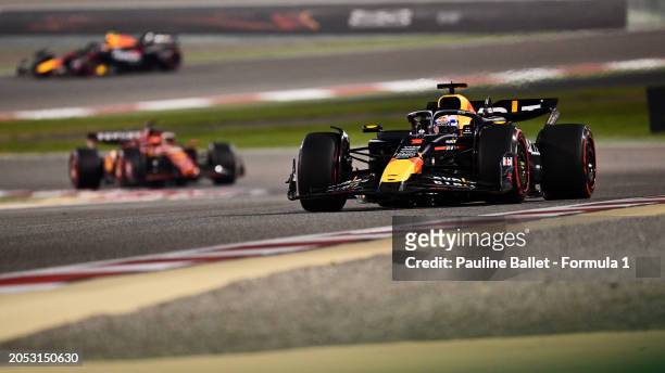 Max Verstappen of the Netherlands driving the Oracle Red Bull Racing RB20 leads Charles Leclerc of Monaco driving the Ferrari SF-24 during the F1...