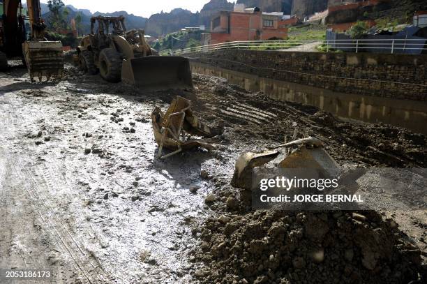 Heavy machinery washed away after the Aruntaya River overflowed due to heavy rains is seen in the Irpavi II neighborhood in southern La Paz on March...