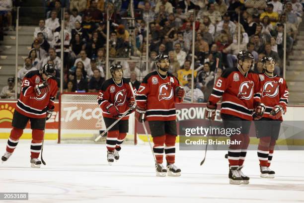 Grant Marshall, Scott Gomez, Scott Niedermayer, Tommy Albelin and Patrik Elias of the New Jersey Devils skate during a break in action against the...