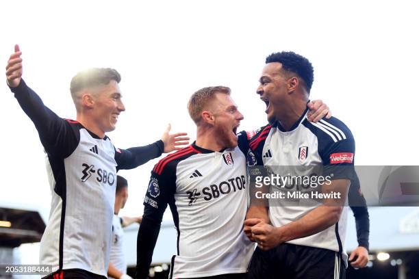 Rodrigo Muniz of Fulham celebrates scoring his team's second goal with teammates Harry Wilson and Harrison Reed during the Premier League match...