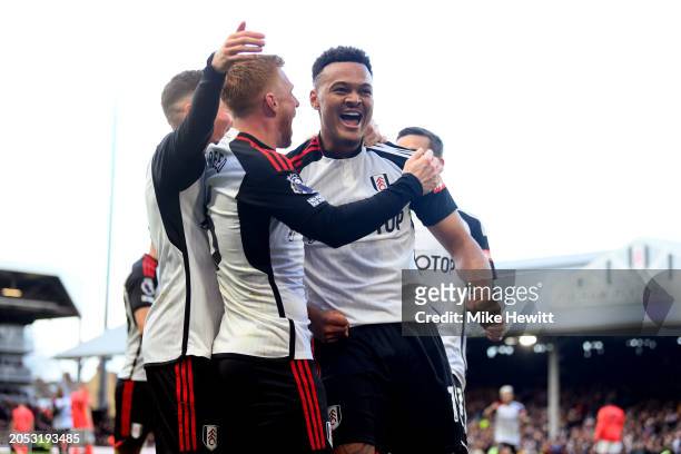 Rodrigo Muniz of Fulham celebrates scoring his team's second goal with teammates Harry Wilson and Harrison Reed during the Premier League match...