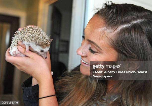 Livija Wells is happy to hear firefighters rescued her hedgehog Milo when her parents attic caught on fire after it was struck by lightning on...